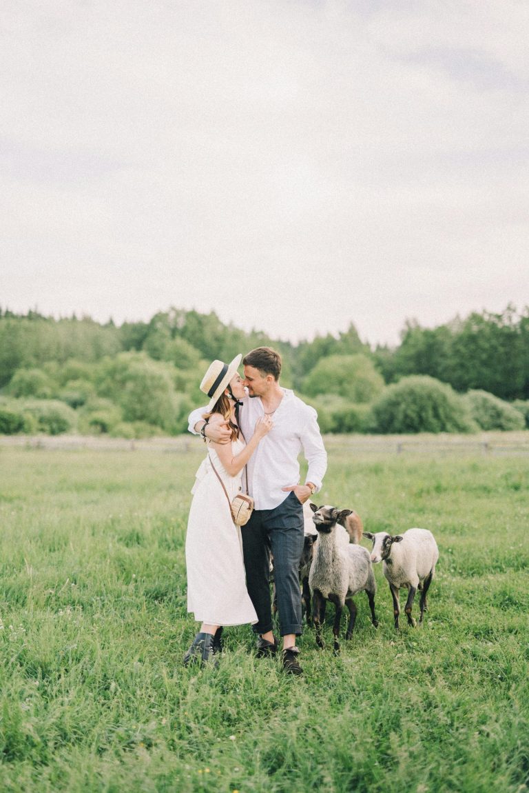 man and woman enjoying a romantic moment in a field with sheep - benefits of quitting porn